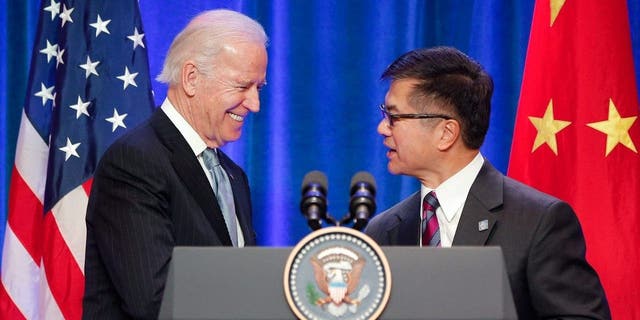 BEIJING, CHINA - DECEMBER 05: U.S Vice President Joe Biden (L) shake hands with U.S. ambassador to China Gary Locke (R) during his business leader breakfast at the The St. Regis Beijing hotel on December 5, 2013 in Beijing, China. U.S Vice President Joe Biden will pay an official visit to China from December 4 to 5.  