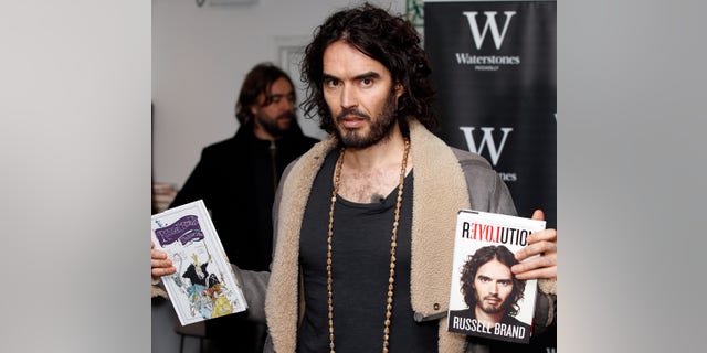 LONDON, UNITED KINGDOM - DECEMBER 5: Russell Brand pictured during a Book Signing for 'Revolution' at Waterstone's, Picadilly on December 5, 2014 in London, England.