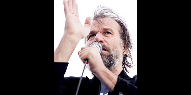 Dutch world record holder Wim Hof, known as "The Ice Man," speaks as he tries to set a new world record for the longest and largest ice bath on April 21, 2015, in Eindhoven.