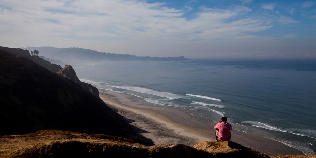 This file image shows Blacks Beach in San Diego, California. Police confirm two boats carrying migrants crashed off the coast overnight.