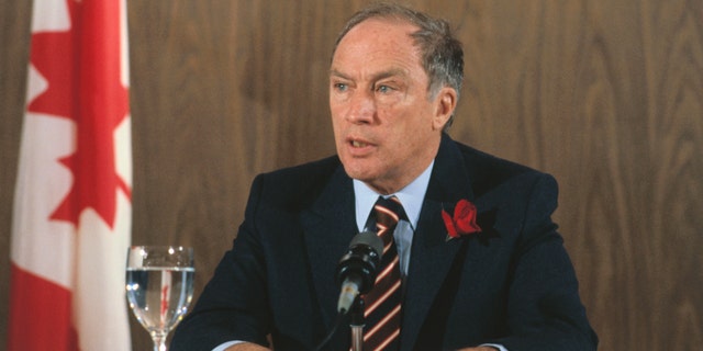 1982- Close-up of Canadian Prime Minister Pierre Elliott Trudeau, seated at a desk with a glass of water. Photo filed 9/8/1982.