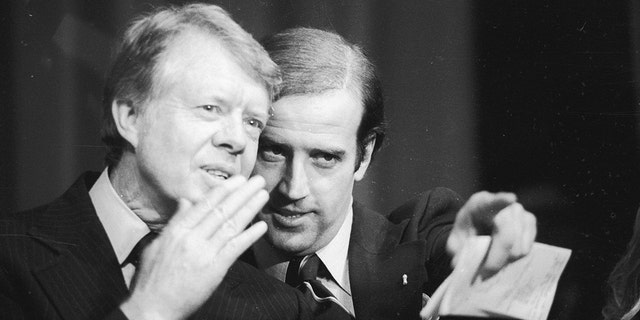 Delaware's U.S. Senator Joseph Biden points out a friend in the crowd at the Padua Academy to President Jimmy Carter during a fundraiser. 