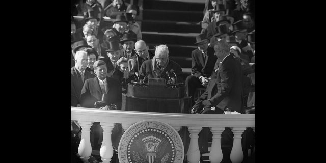 Poet Robert Frost (center) reads one of his poems during John F. Kennedy's inauguration ceremony at the Capitol in Washington, D.C., on Jan. 20, 1961.