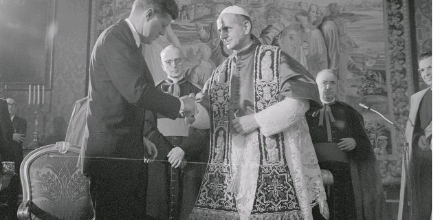 Pope Paul VI and President John F. Kennedy shake hands during their meeting at the Apostolic Palace. The pontiff received Kennedy in a 36-minute private audience. Pope Paul VI canonized Elizabeth Ann Seton, the first American saint, in 1975.