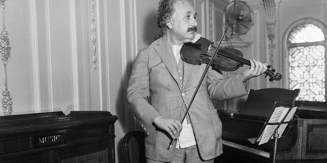 Professor Albert Einstein shown playing his violin in 1932.