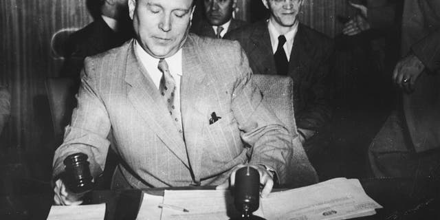 Russian diplomat Jacob Malik, chairman of the Security Council, brings a U.N. meeting to order in August 1950.