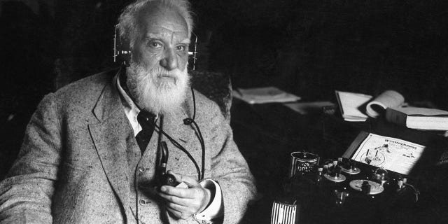 American inventor Alexander Graham Bell (1847-1922) with one of his inventions, circa 1910. Bell engineered the first intelligible electronic transmission of voice and patented the telephone, and was a founding member and president of the National Geographic Society.