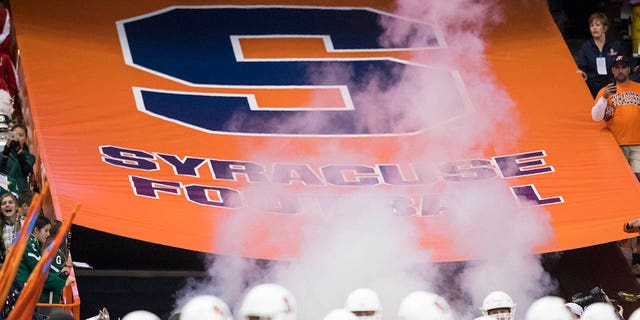 Syracuse Orange players enter the field before the game against the Florida State Seminoles on Nov. 19, 2016, at the Carrier Dome in Syracuse, New York.