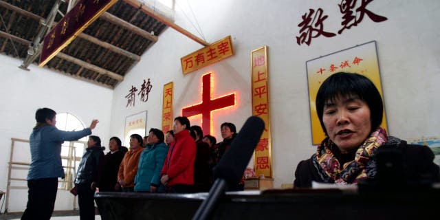 A choir sings during a rehearsal for performance to mark the Chinese New Year at a countryside church in Luoyang of Henan Province, China.