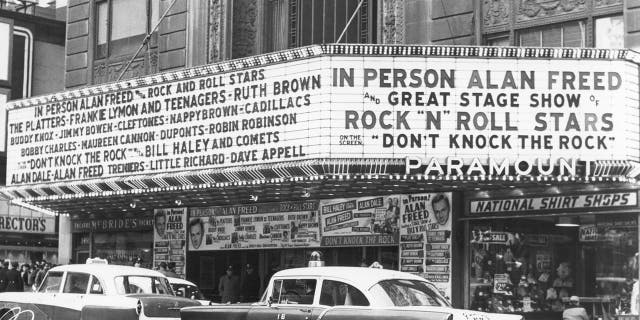 Photo of marquee at unspecified theater promoting a rock 'n' roll concert hosted by DJ and early rock figure Alan Freed. The marquee also highlights