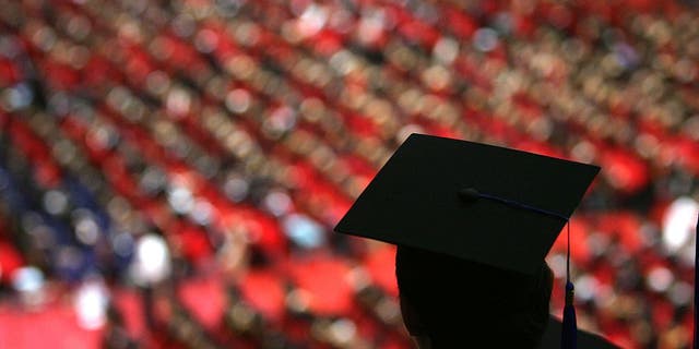 Students graduate during a ceremony held for 3,768 master and 898 doctorates being given out at the Tsinghua University on July 18, 2007 in Beijing. China faces a major challenge in meeting its goal of creating 9 million jobs this year, according to Tian Chengping, Minister of Labour and Social Security. Approximately 5 million college graduates, the largest number in history, will enter the job market this year, in addition to surplus rural labourers swarming into cities for work.