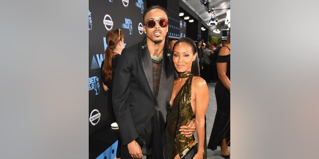 August Alsina and Jada Pinkett Smith pose on the red carpet together at the 2017 BET Awards.