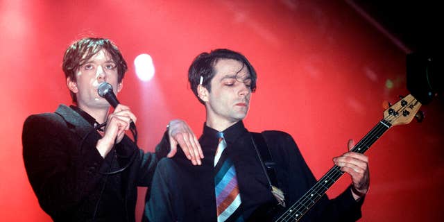 Pulp band members Jarvis Cocker and Steve Mackey performing live onstage in 1995. Mackey joined the band in 1989.