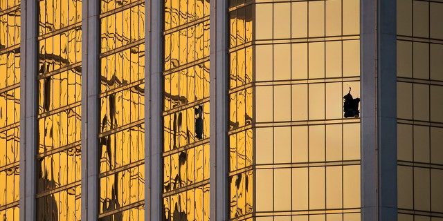 A window is broken on the 32nd floor of the Mandalay Bay Resort and Casino where a gunman opened fire on a concert crowd on Sunday night, Oct. 3, 2017 in Las Vegas. 