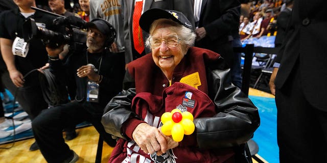 Sister Jean Dolores Schmidt celebrates with the Loyola Ramblers after defeating the Kansas State Wildcats during the 2018 NCAA men's basketball tournament South regional at Philips Arena March 24, 2018, in Atlanta. Loyola defeated Kansas State 78-62.  