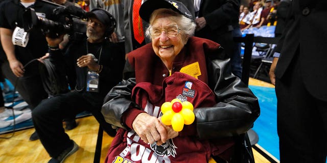 Sister Jean Dolores Schmidt celebrates with the Loyola Ramblers after defeating the Kansas State Wildcats during the 2018 NCAA men's basketball tournament South regional at Philips Arena March 24, 2018, in Atlanta. Loyola defeated Kansas State 78-62.