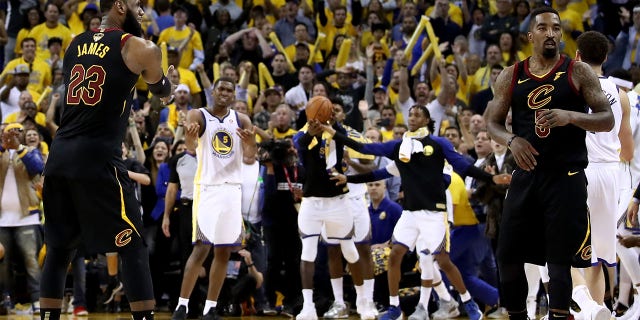 LeBron James, #23, and JR Smith, #5 of the Cleveland Cavaliers, react as time expries in regulation against the Golden State Warriors in Game 1 of the 2018 NBA Finals at ORACLE Arena on May 31, 2018 in Oakland, California.