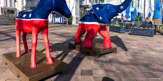 Democratic Mule and Republican Elephant statues symbolize the American 2-party political system in front of Willard Hotel.