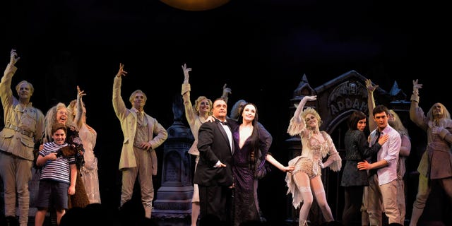 Actors Nathan Lane and Bebe Neuwirth join the cast of "The Adams Family" as they take a bow following the opening night of the Broadway production of "The Addams Family" at the Lunt-Fontanne Theatre on April 8, 2010 in New York City. 