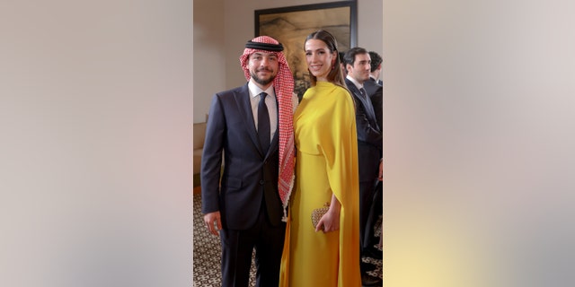 Crown Prince Hussein and his fiancée Rajwa Al Saif at his sister's wedding.