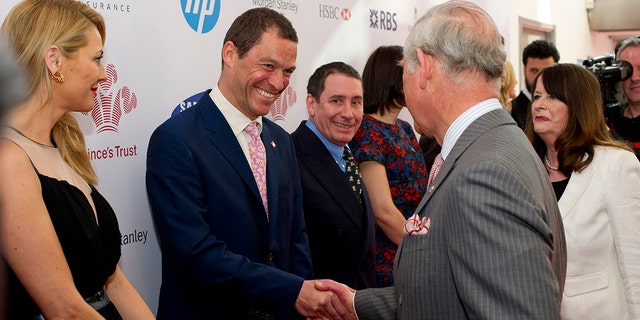 Dominic West, who played Prince Charles in the Netflix series. "Crown," greets the future king at The Prince's Trust event in London in 2014.