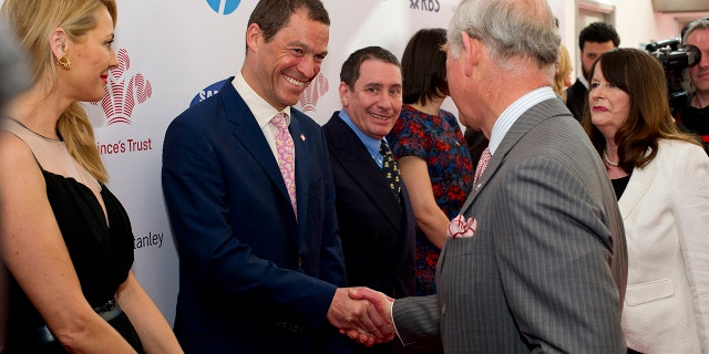 Dominic West, who stars as Prince Charles in Netflix's "The Crown," meets the future king at a 2014 event for The Prince's Trust in London.