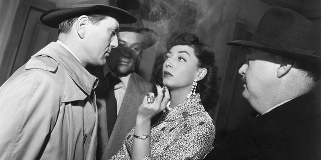Charles McGraw, left, Marie Windsor and Don Beddoe in a scene from director Richard Fleischer's 1952 film "The Narrow Margin."