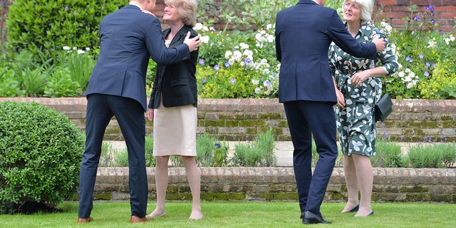 Prince Harry (left) and Prince William are seen here greeting their aunts Lady Sarah McCorquodale (second left) and Lady Jane Fellowes (right) during the unveiling of a statue they commissioned of their mother Diana, Princess of Wales, in the Sunken Garden at Kensington Palace, on what would have been her 60th birthday on July 1, 2021, in London, England. 