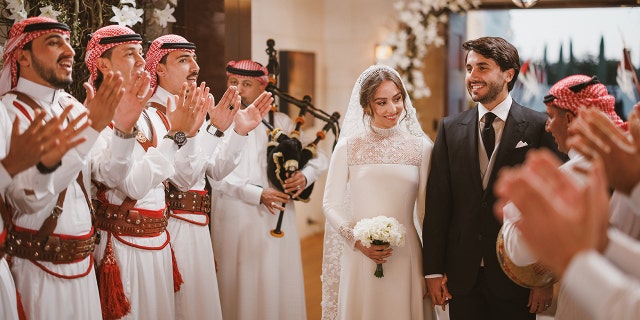 The ceremony was a lavish affair and guests were surrounded by white flowers.