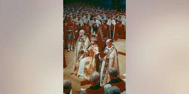 Queen Elizabeth II at her coronation ceremony at Westminster Abbey, London, circa 1953. The oil used for her coronation was made from musk deer, civet cat and sperm whale.