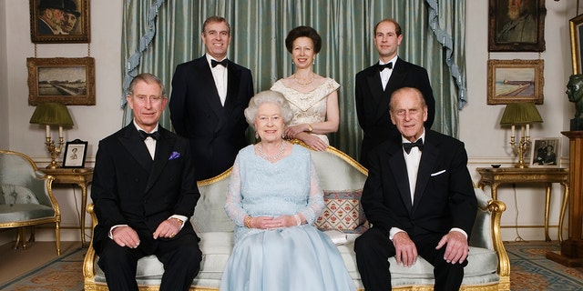 Queen Elizabeth II (center) and her husband Prince Philip (right) are seen here with their children, circa 2007. The former Prince Charles (left) is seated next to his mother. Also featured in the photo: Princess Anne (above center), Prince Andrew (top left) and Prince Edward (top right). 
