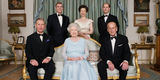 Queen Elizabeth II (center) and her husband Prince Philip (right) are seen here with their children, circa 2007. The former Prince Charles (left) is seated next to his mother. Also featured in the photo: Princess Anne (above center), Prince Andrew (top left) and Prince Edward (top right).