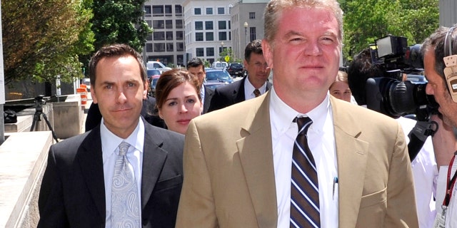 Victor Zaborsky, left, is seen here walking behind his attorney Thomas G. Connolly, center, as they left the courthouse on June 29, 2010, in Washington, D.C. All three of the defendants in the Robert Wone conspiracy trial were found not guilty by a District of Columbia Superior Court judge.