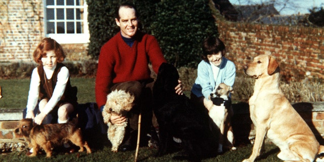 Sarah Ferguson, the Duchess of York, left, with her sister Jane, and their father, Major Ronald Ferguson, at Dummer Down House. With them are their dogs Kerry, Puffy, Tweed, Tigger and George.