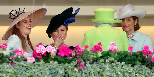 From left: Princess Beatrice; Sarah, Duchess of York; and Lady Carolyn Warren walk with Queen Elizabeth II in the Royal Box before watching the queen's horse Elector run in the King Edward VII stakes on day four of Royal Ascot at Ascot Racecourse June 22, 2018, in Ascot, England.