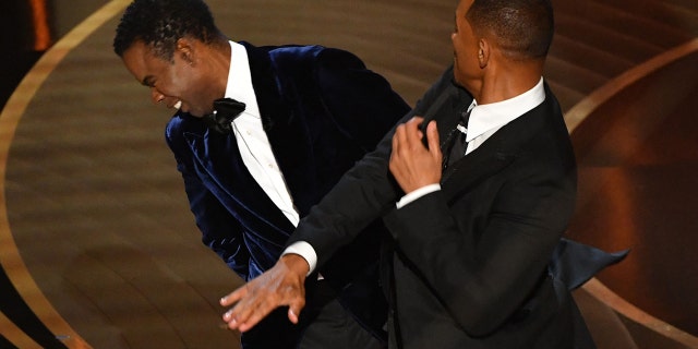 Will Smith is seen here slapping Chris Rock onstage during the 94th Oscars at the Dolby Theatre in Hollywood, California on March 27, 2022.