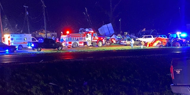 First responders are seen amid damage from the storm in Silver City, Mississippi.