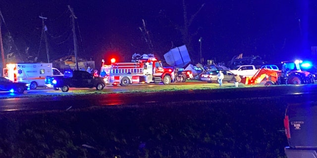 First responders arem seen amid damage from the storm in Silver City, Mississippi.