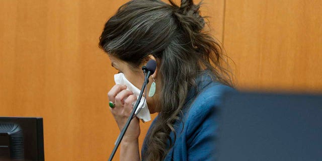 Polly Grasham, daughter of Terry Sanderson, reacts to questioning in court Thursday.