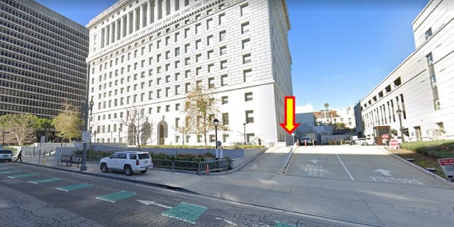 An image shows a pick-up/drop-off point for Los Angeles County District Attorney's Office employees who use a free shuttle service to and from their vehicles or public transportation.