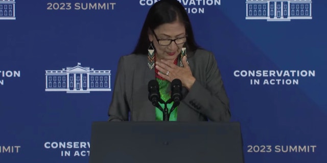 Interior Secretary Deb Haaland chokes up speaking about conservation efforts on March 21, 2023.