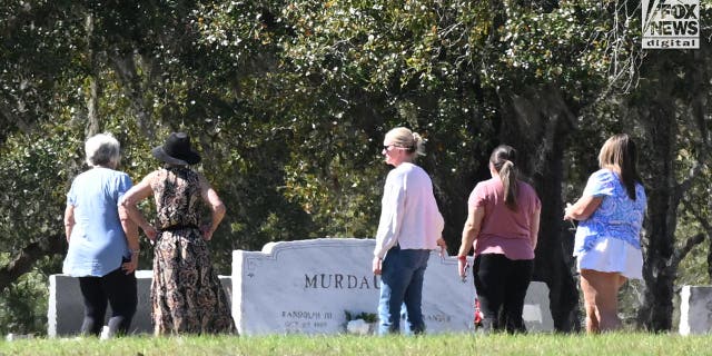Karen Morrison (center) with four friends at Hampton Cemetery where Maggie and Paul Murdaugh are buried, in Hampton, South Carolina, Sunday, March 5, 2023. The mother and son were killed by Alex Murdaugh in 2021.