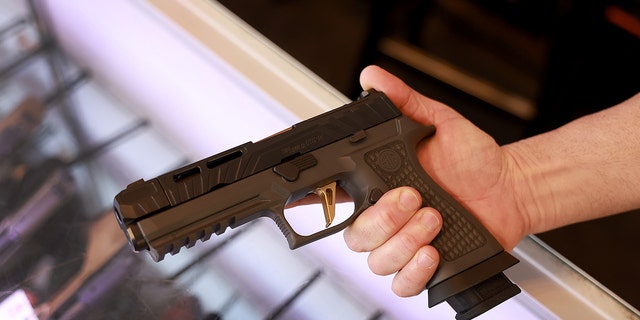 A Sig Sauer P320 handgun at the WEX Gunworks store Jan. 31, 2023, in Delray Beach, Fla. 