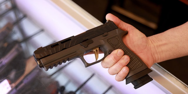 A Sig Sauer P320 handgun at the WEX Gunworks store Jan. 31, 2023, in Delray Beach, Fla. 