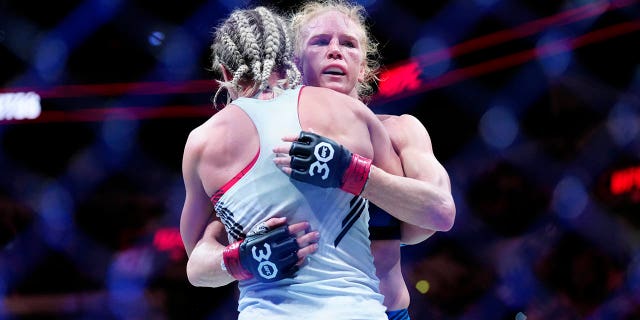 Holly Holm hugs Yana Santos during their bantamweight fight at the AT&T Center on March 25, 2023 in San Antonio, Texas.