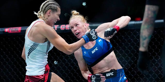 Holly Holm punches Yana Santos during the UFC on ESPN 43 event at AT&amp;T Center on March 25, 2023, in San Antonio. 