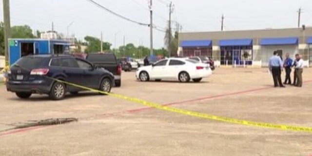 Houston police at the scene of a deadly attempted robbery on Tuesday.