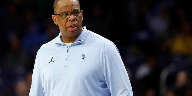 North Carolina Tar Heels head coach Hubert Davis looks down from his bench during a men's college basketball game between the North Carolina Tar Heels and the Notre Dame Fighting Irish on February 22, 2023 at Purcell Pavilion in South Bend, Indiana .