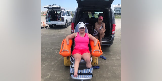 Texas mom suffers quadruple amputation, credits her faith and a little dog for pulling her through 3 Wyndi Adkins enjoys the beach from her chair, above.