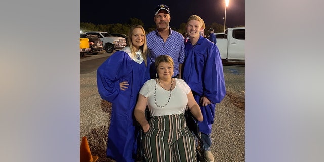 Wyndi Adkins and her husband are shown attending their son and daughter's graduation ceremony.